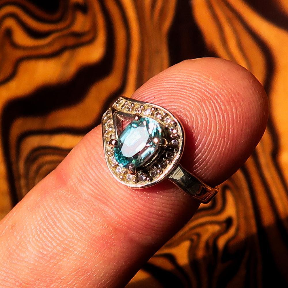 Sterling Silver Solitaire Loop Ring with oval Cut Blue Zircon and 21 CZ - Size 5-0