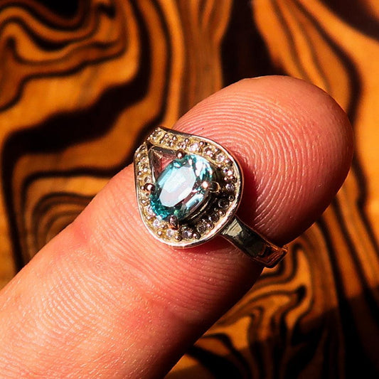 Sterling Silver Solitaire Loop Ring with oval Cut Blue Zircon and 21 CZ - Size 5-0