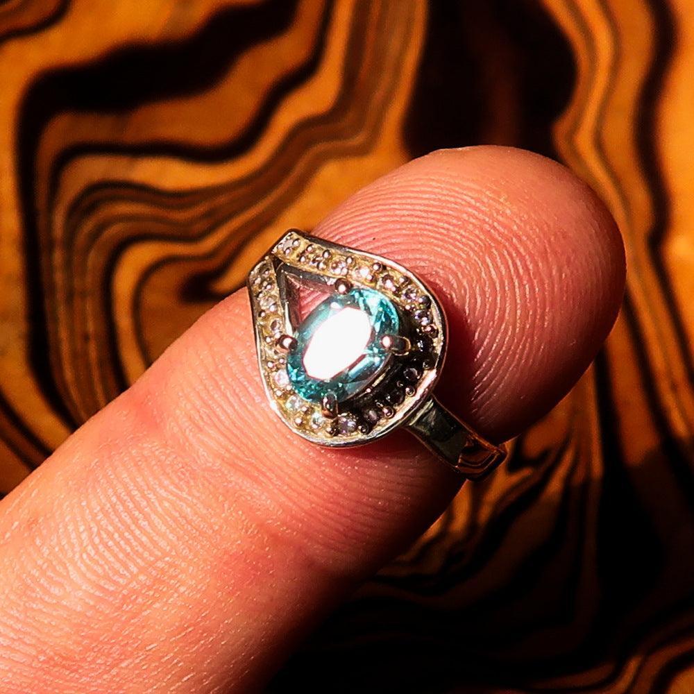 Sterling Silver Solitaire Loop Ring with oval Cut Blue Zircon and 21 CZ - Size 5-1