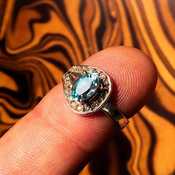 Sterling Silver Solitaire Loop Ring with oval Cut Blue Zircon and 21 CZ - Size 5-3